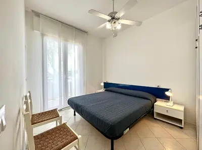 Letto o letti in una camera di DB Residence con Piscina - Carraro Immobiliare - Family Apartments