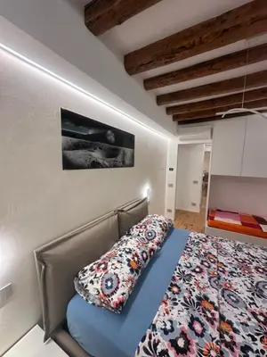 Letto o letti in una camera di PALAZZO MICHELIN SUITE
