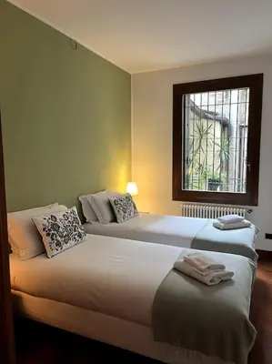 Letto o letti in una camera di Il Portico. Charm apartment, Vicenza downtown.
