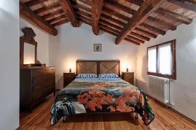 Letto o letti in una camera di Country house pisani 120SQM