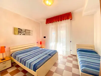 Letto o letti in una camera di Residence Aurora Park - Carraro Immobiliare - Family Apartments