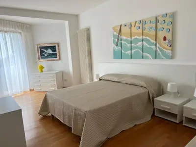 Letto o letti in una camera di Appartamenti Aquamarina