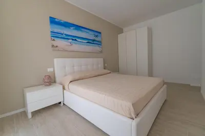 Letto o letti in una camera di Appartamento Ca' Liscia Ruja