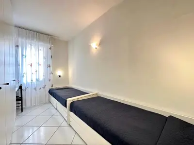Letto o letti in una camera di Residence Vera 101 - Carraro Immobiliare - Family Apartments