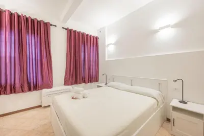 Letto o letti in una camera di Casa Luna - 10 min from Venice Train Station