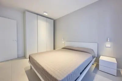 Letto o letti in una camera di Sun Village Apartments