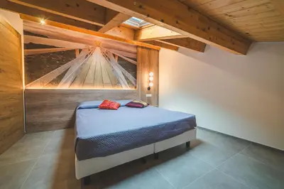 Letto o letti in una camera di BATTISTI HOSPITALITY - un'avventura