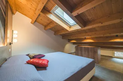 Letto o letti in una camera di BATTISTI HOSPITALITY - un'avventura