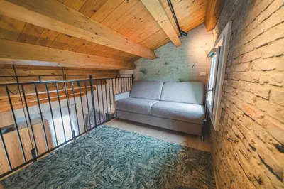 Letto o letti in una camera di BATTISTI HOSPITALITY - un'avventura