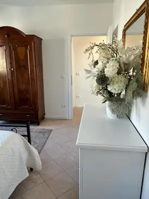 Letto o letti in una camera di Villa bifamiliare per famiglie con giardino.