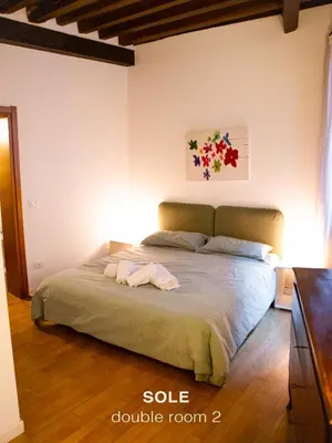 Letto o letti in una camera di Sole & Luna apartments