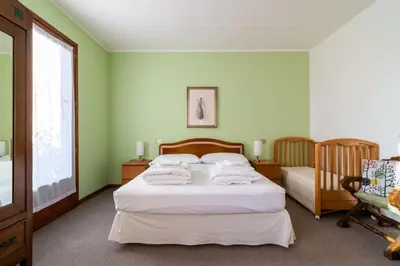 Letto o letti in una camera di Casa Alba