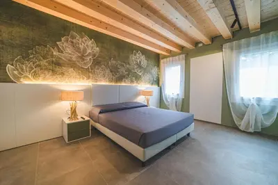 Letto o letti in una camera di BATTISTI HOSPITALITY - motocicletta