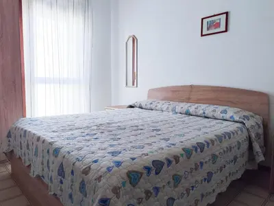 Letto o letti in una camera di RUBINO