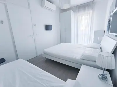 Letto o letti in una camera di RUBINO
