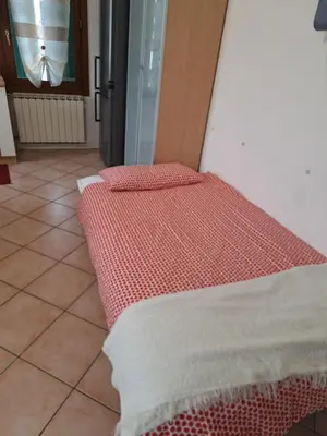 Letto o letti in una camera di Casa Ida