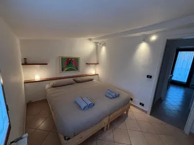 Letto o letti in una camera di La Mansardina
