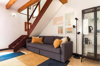 Area soggiorno di Tintoretto Cozy Duplex R&R