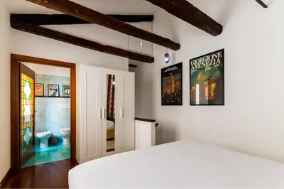 Letto o letti in una camera di Tintoretto Cozy Duplex R&R
