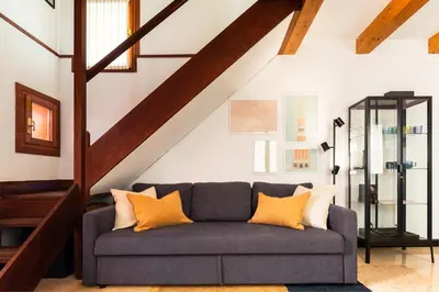 Area soggiorno di Tintoretto Cozy Duplex R&R