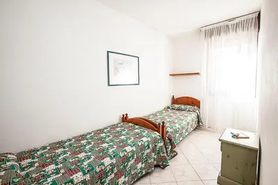 Letto o letti in una camera di Seaside happiness flat and shared pool in Rosolina
