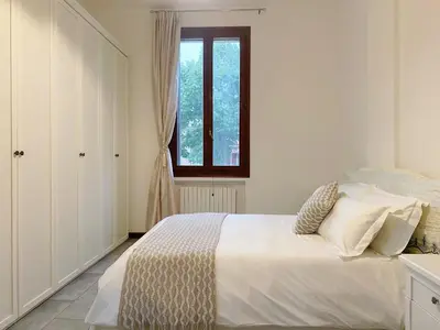 Letto o letti in una camera di Gris Apartment: Venice Mestre