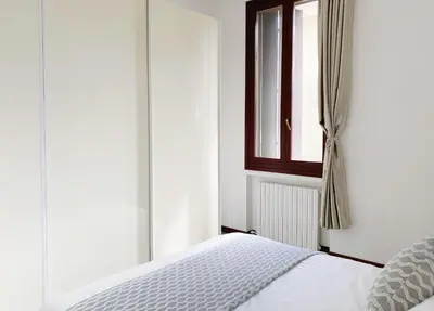 Letto o letti in una camera di Gris Apartment: Venice Mestre