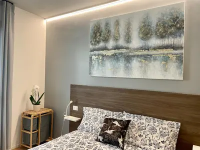 Letto o letti in una camera di Locatelli Apartments - Patio Living 