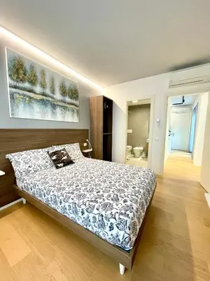 Letto o letti in una camera di Locatelli Apartments - Patio Living 