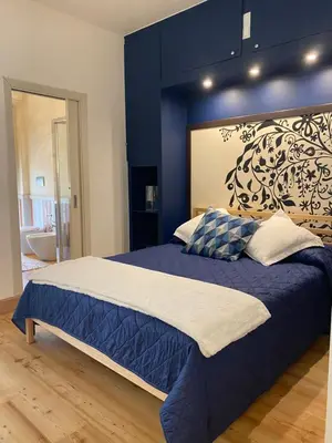 Letto o letti in una camera di Blue Suite
