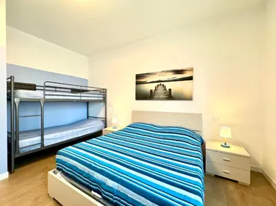 Letto o letti in una camera di Napoleone - Carraro Immobiliare - Family Apartments