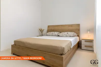Letto o letti in una camera di GIGI HOUSE -appartamento PIAZZA MAZZINI- 200m dal mare
