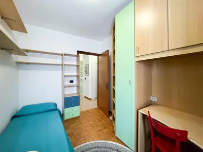 Letto o letti in una camera di Family App4rent Betulle 5 Jesolo
