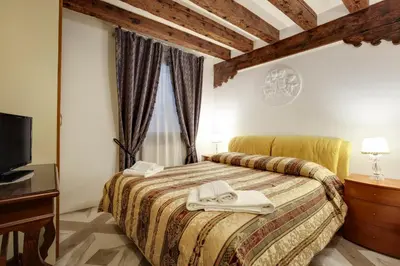 Letto o letti in una camera di Casa Angeli L.T. M0270422137