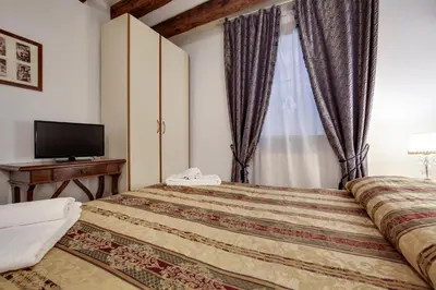 Letto o letti in una camera di Casa Angeli L.T. M0270422137