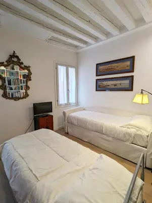 Letto o letti in una camera di Corte San Marco