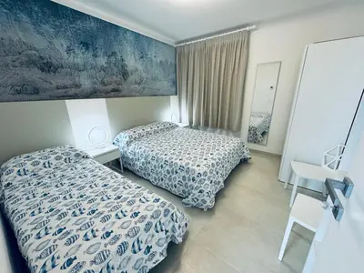 Letto o letti in una camera di App4rent Villa Zanetti - Appartamenti con spiaggia privata frontemare