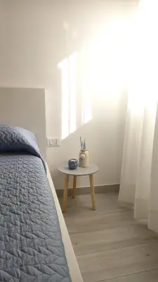 Letto o letti in una camera di Cas'Ale