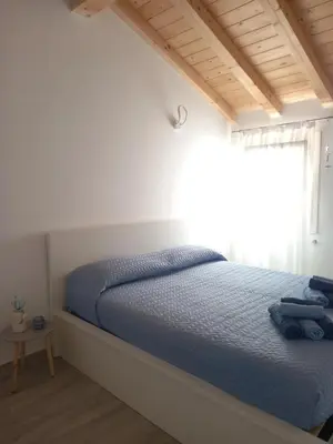 Letto o letti in una camera di Cas'Ale