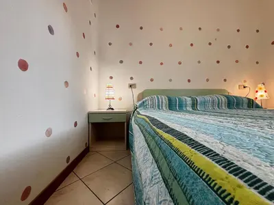 Letto o letti in una camera di Comfortable flat in Bibione-Beahost