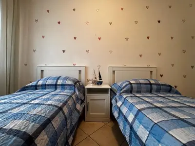 Letto o letti in una camera di Comfortable flat in Bibione-Beahost