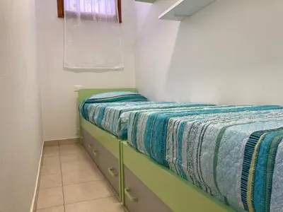 Letto o letti in una camera di Lovely flat in the center of Rosolina Mare