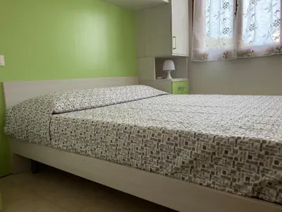 Letto o letti in una camera di Lovely flat in the center of Rosolina Mare
