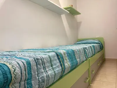 Letto o letti in una camera di Lovely flat in the center of Rosolina Mare