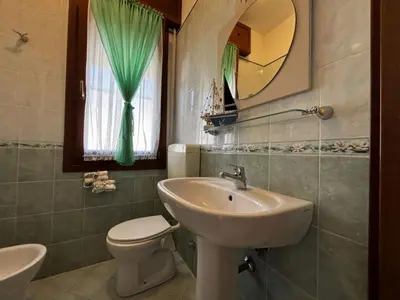 Bagno di Renovated apartment in Rosolina
