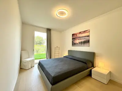 Letto o letti in una camera di Residence Wave Island - Carraro Immobiliare - Family Apartments