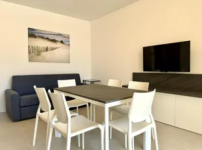 TV o dispositivi per l'intrattenimento presso Residence Wave Island - Carraro Immobiliare - Family Apartments