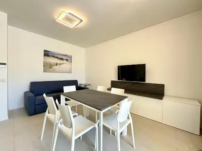 TV o dispositivi per l'intrattenimento presso Residence Wave Island - Carraro Immobiliare - Family Apartments