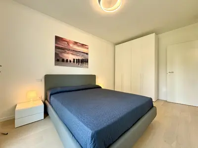 Letto o letti in una camera di Residence Wave Island - Carraro Immobiliare - Family Apartments