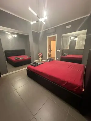 Letto o letti in una camera di ERMAN HOUSE Perla nera veneziana